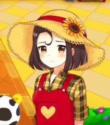 a girl wearing a straw hat with a sunflower on it stands next to a cow