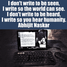 a laptop with a quote from abhijit naskar on the screen