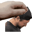 a hand is holding a man 's head in a pixel art .