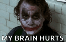 a close up of a joker with a smiley face and the words `` my brain hurts '' below him .