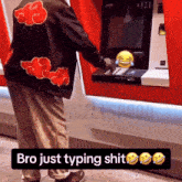 a man wearing a jacket that says bro just typing shit is using an atm machine