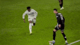 a soccer player with the number 11 on his jersey is running on the field .