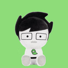 a stuffed toy with a green worm on it 's chest