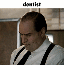 a man in a white shirt and black suspenders has the word dentist below him