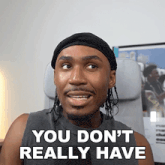 a man sitting in a chair with the words " you don 't really have " written below him