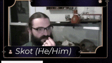 a picture of a man with a beard and glasses says skott ( he / him ) on the bottom