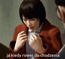 a woman in a red jacket is crying with the words ja kiedy rower do chodzenia written below her