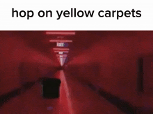 a person is standing in a dark room with the words `` hop on yellow carpets '' on the bottom .