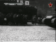 a black and white photo of people standing in front of a sign that says ' mar ' on it