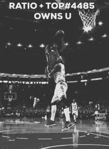 a black and white photo of a basketball game with the caption ratio + top # 485 owns u.