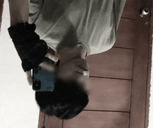 a man is taking a picture of himself with a cell phone
