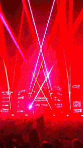 a sign that says fire on stage with red lights behind it