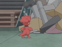 a red dinosaur is standing in front of a pile of boxes