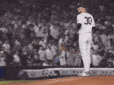 a baseball player with the number 30 on his shirt
