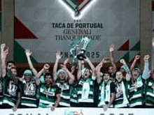 a group of people are standing next to each other holding a trophy .