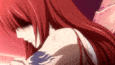 a girl with red hair and a tattoo on her arm