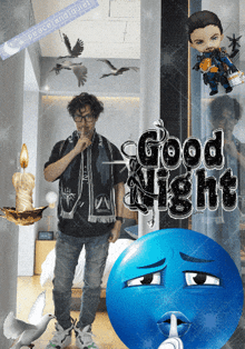 a man standing next to a blue smiley face with the words good night written on it