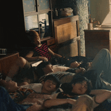 a group of people laying on their stomachs on the floor