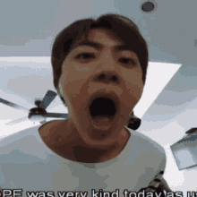 a man is making a funny face with his mouth wide open and the words pe was very kind today as well