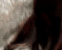 a blurred image of a person 's face with chinese writing