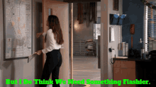a woman standing in front of a door with the words but i do think we need something flashier on the bottom