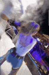 a woman is dancing in front of a crowd at a music festival