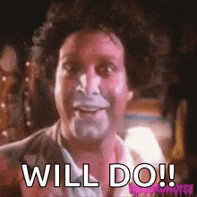 a man with makeup on his face is smiling and says will do !