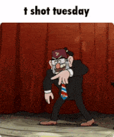 a man in a suit and tie is pointing at something with the words t shot tuesday above him