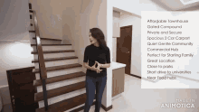 a woman stands in front of a set of stairs and a sign that says affordable townhouse