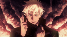 a man with blonde hair is holding something in his hand