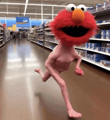 elmo without a shirt is running in a store aisle