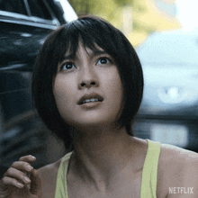 a close up of a woman 's face with netflix written on the bottom
