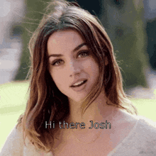 a close up of a woman 's face with the words hi there josh on the bottom