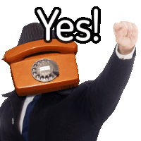 a man wearing a suit and tie has a telephone on his head and says yes