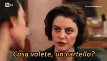 a woman talking to another woman with the words cosa volete un cartello