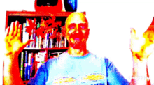 a man in a blue shirt is waving his hands