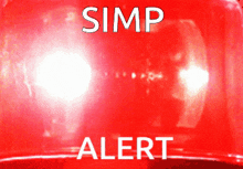a red light that says simp alert in white letters