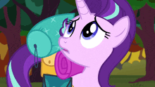 a cartoon of a pony with a purple mane and a horn
