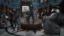 a group of people in armor standing around a podium