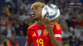 a soccer player with the number 19 on his shirt