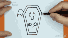 a person is drawing a letter l on a piece of paper with a pen