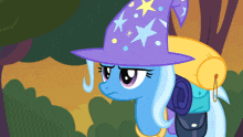 a cartoon pony wearing a purple hat with stars