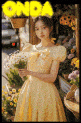 a girl in a yellow dress holds a bouquet of flowers in front of a sign that says onda