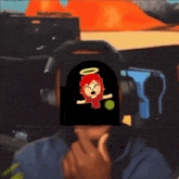 a person wearing headphones has a picture of a girl with an angel on her head