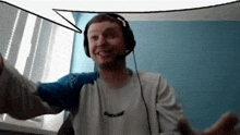 a man wearing headphones and a shirt that says reebok on it
