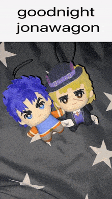 two stuffed jojo 's bizarre adventure characters laying on a blanket