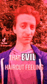 a man with red hair is standing in front of a tree with the words that evil haircut feeling