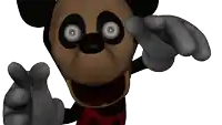 a close up of a mickey mouse pointing