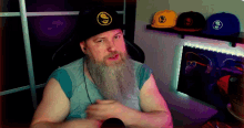a man with a beard wearing a hat that says ' idd ' on it