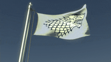 a white flag with a wolf on it